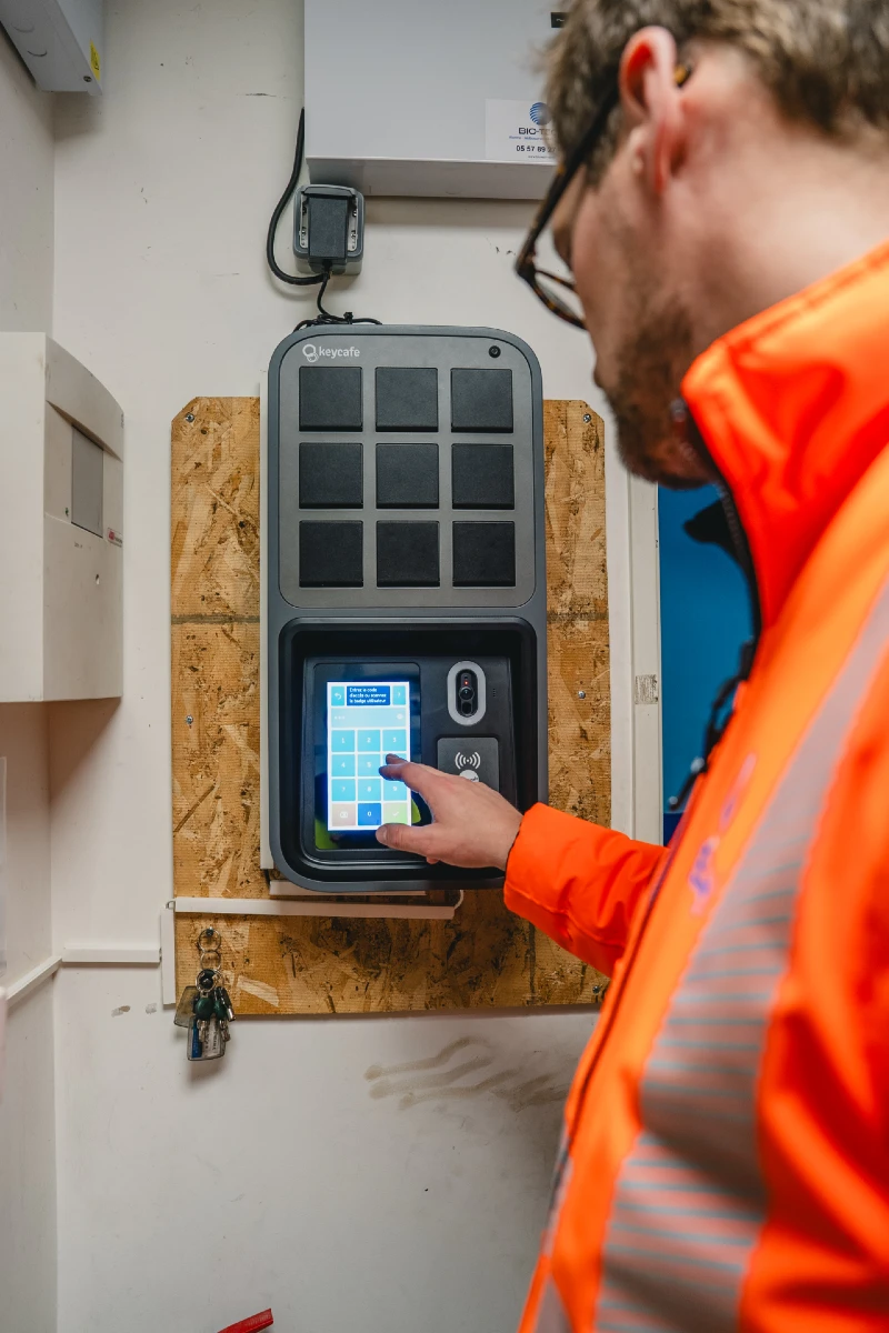 General Manager Victor Bioret tapping a SmartBox screen