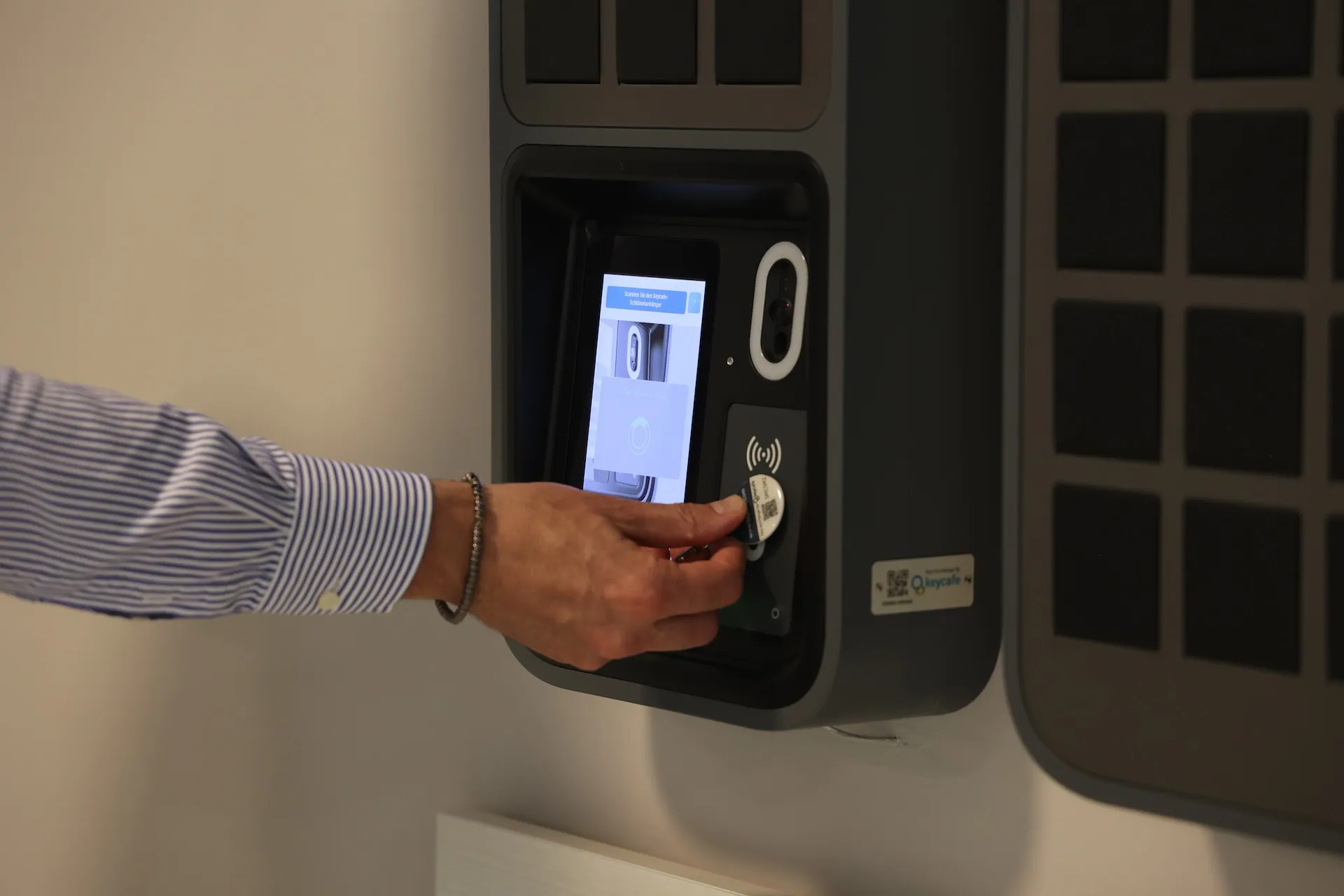 Close up of Antonio Coppola scanning a Keycafe fob at the SmartBox