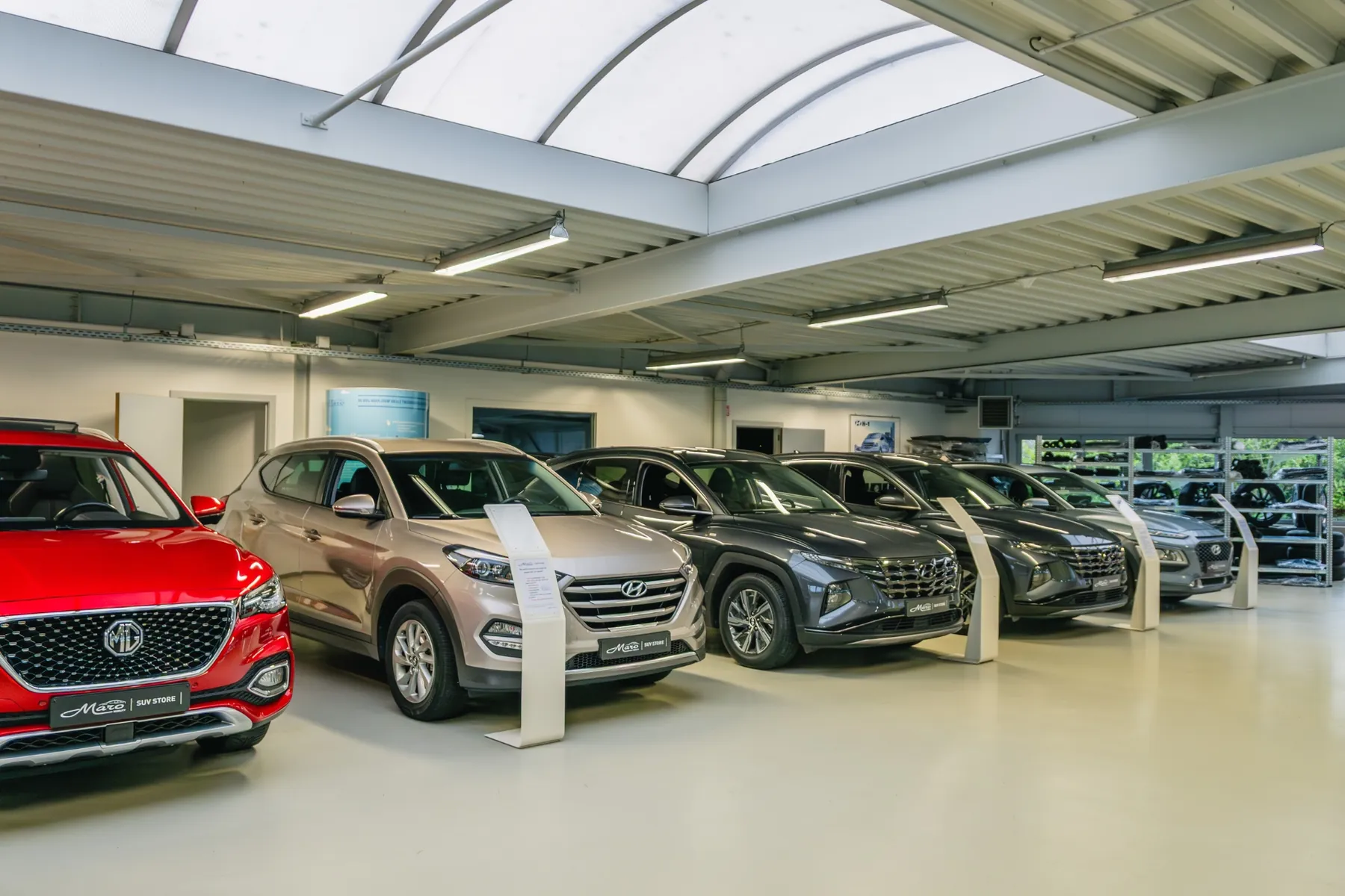 Row of MG and Hyundai vehicles in the Garage Maro showroom