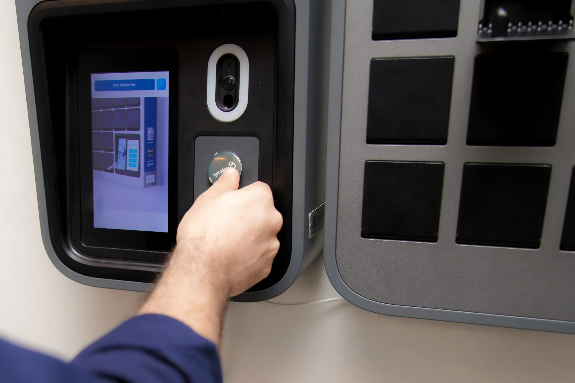 Dynamic SLR staff member scanning a Keycafe fob at the SmartBox