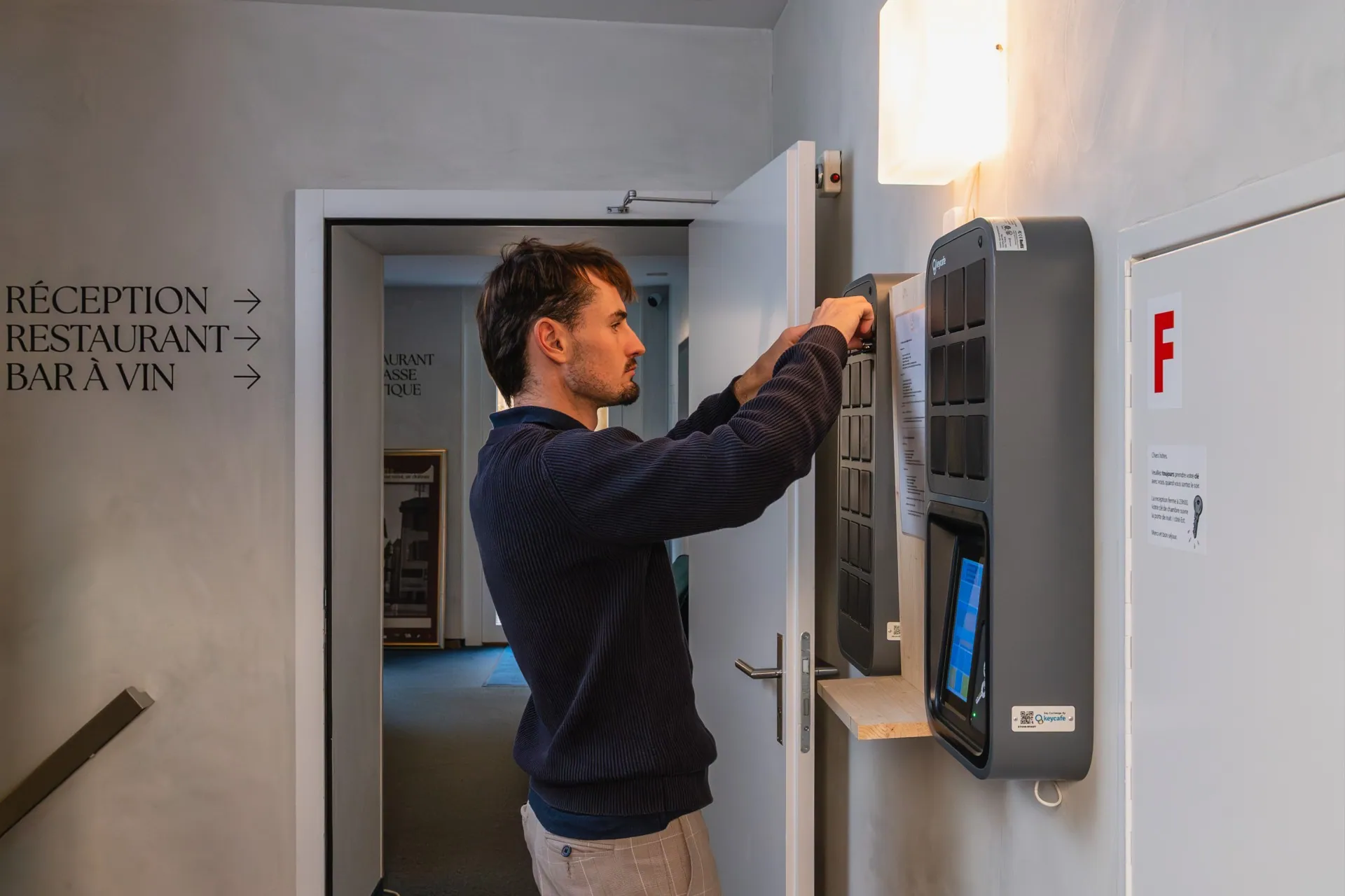 A man picking up keys from the Keycafe SmartBox