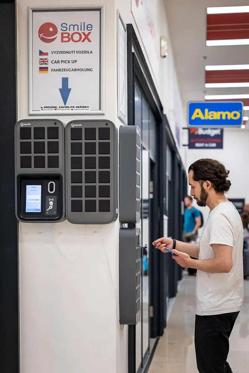 A Smile Parking customer placing his vehicle keys in a SmartBox