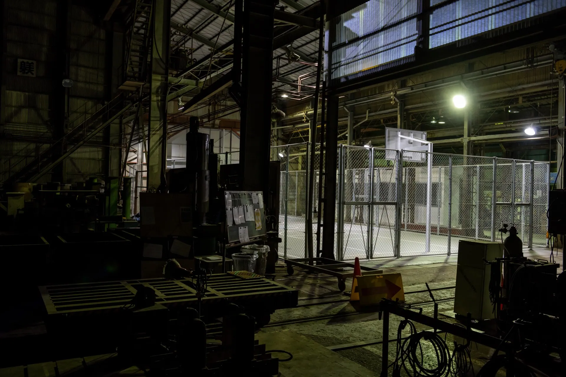 Interior of a Kashiwabara Corporation facility with a basketball court