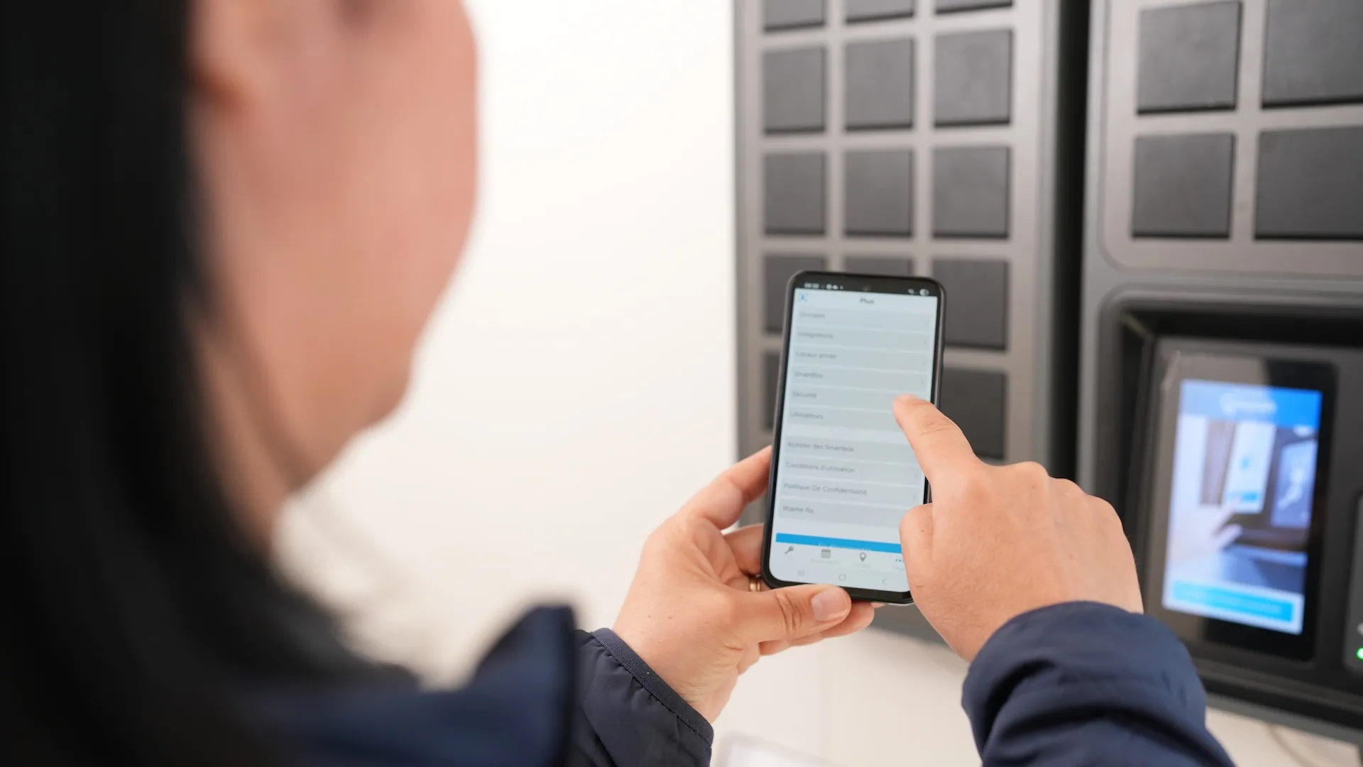 a woman using the keycafe mobile app