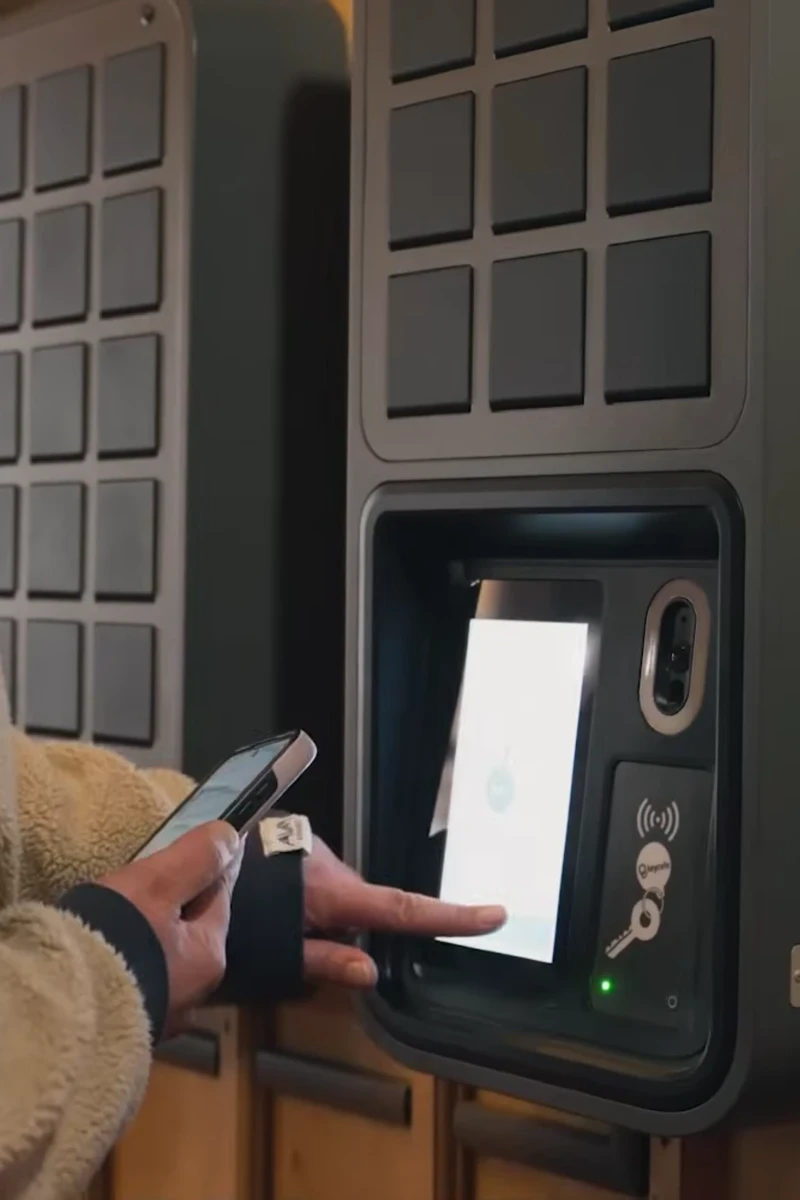 Hotel guest tapping a SmartBox screen