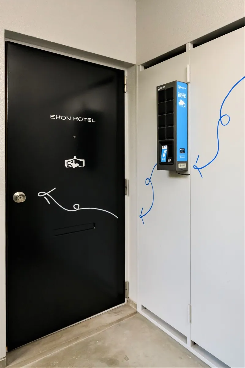 Wall-mounted SmartBox installed outside the front door of Ehon Hotel