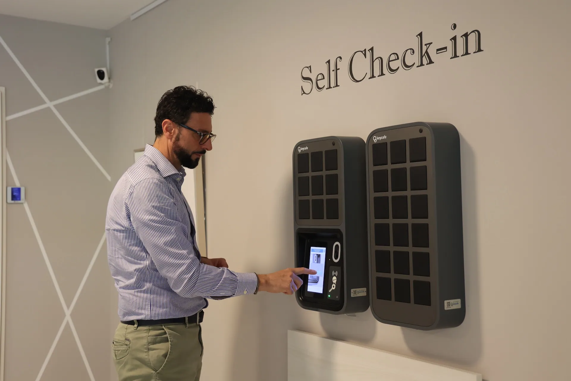 Antonio Coppola tapping the Keycafe SmartBox screen