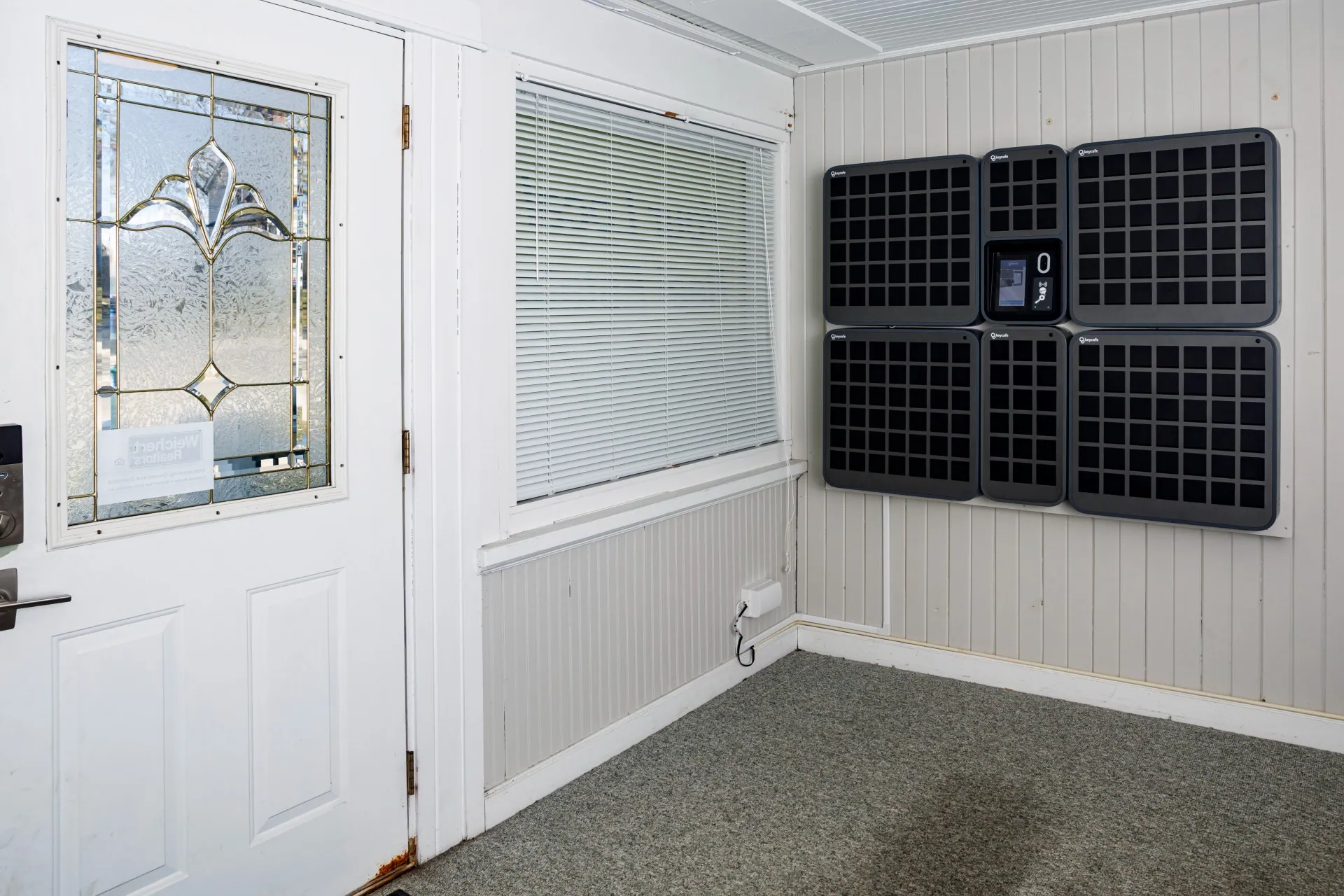 Wall-mounted SmartBoxes by the Your Place Property Management front door