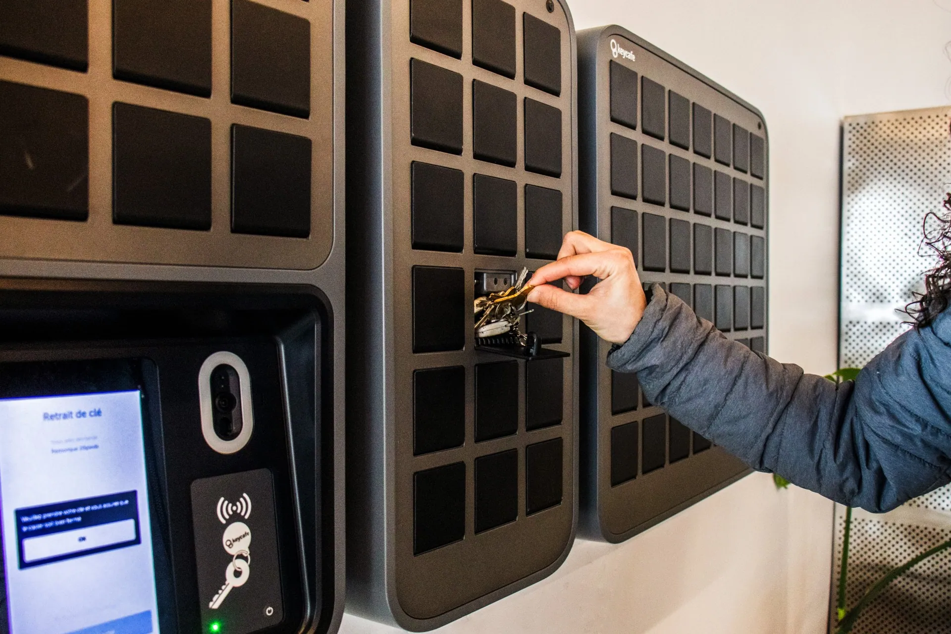 Biotix Environmental Solutions employee placing a key into a SmartBox bin