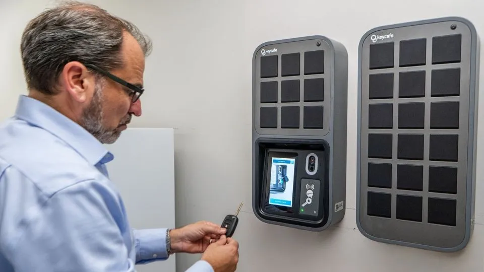 Dealership manager using the SmartBox system to drop off a vehicle key