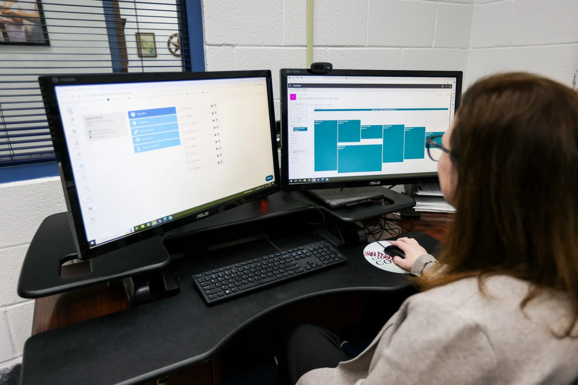 Student and Campus Services Specialist Laurel Rasberry using the Keycafe app on a computer
