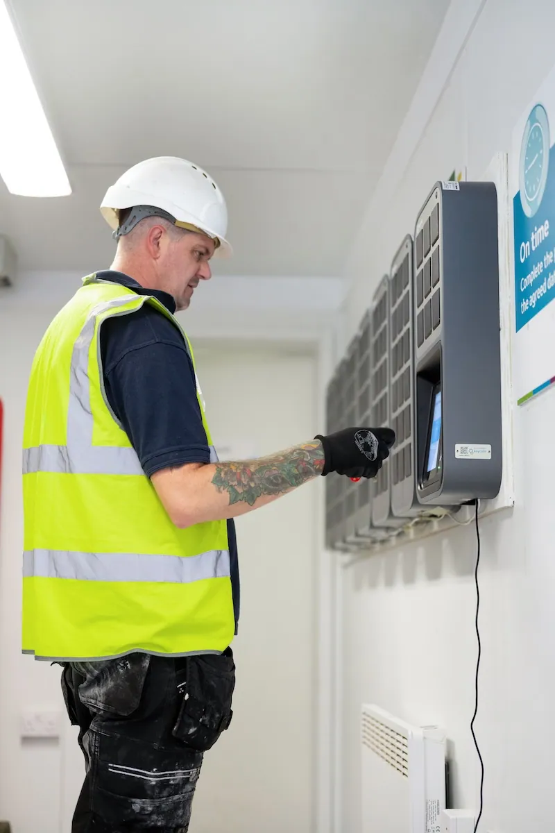 Morgan Sindall construction worker in high-vis vest and hardhat using a SmartBox