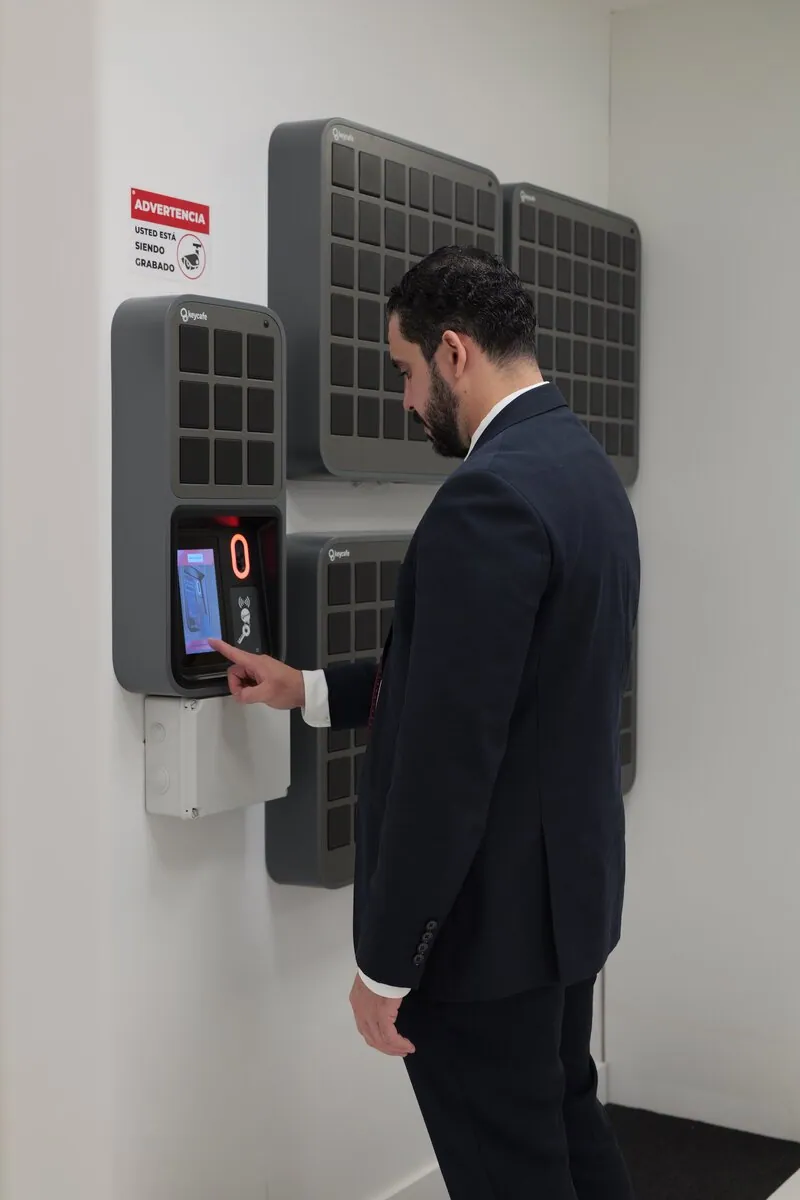 An Engel & Völkers staff member tapping the screen on their SmartBox