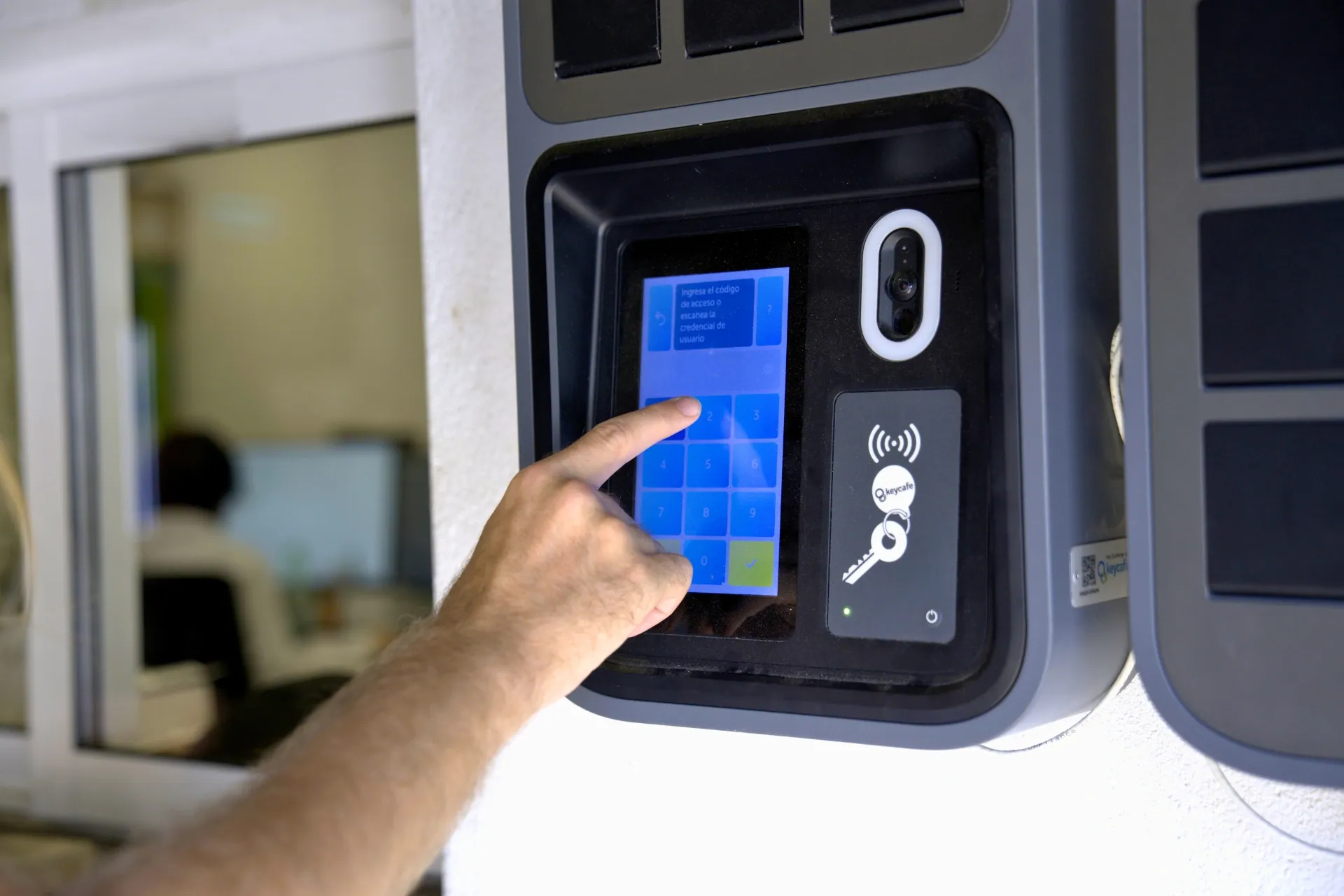 Entering their access code on the SmartBox screen to retrieve their keys