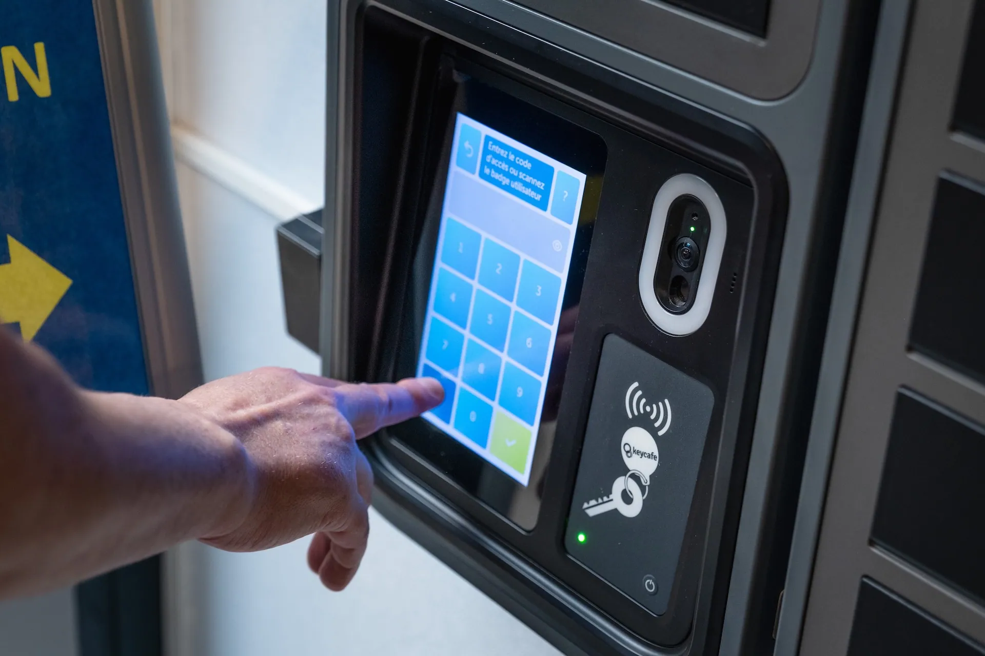Close up of a hand entering a PIN code on the SmartBox screen
