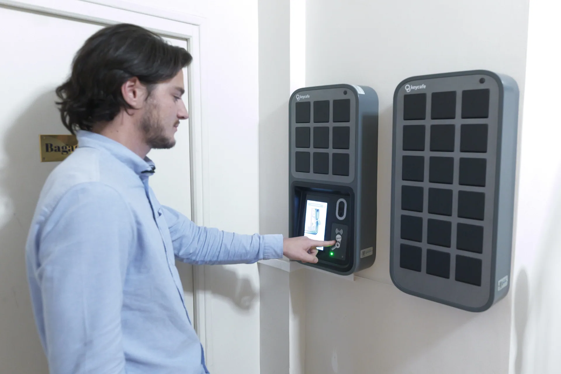 JHMH Program Manager Sébastien Motis operating Keycafe key management terminal at Quartier Libre Saint-Georges.
