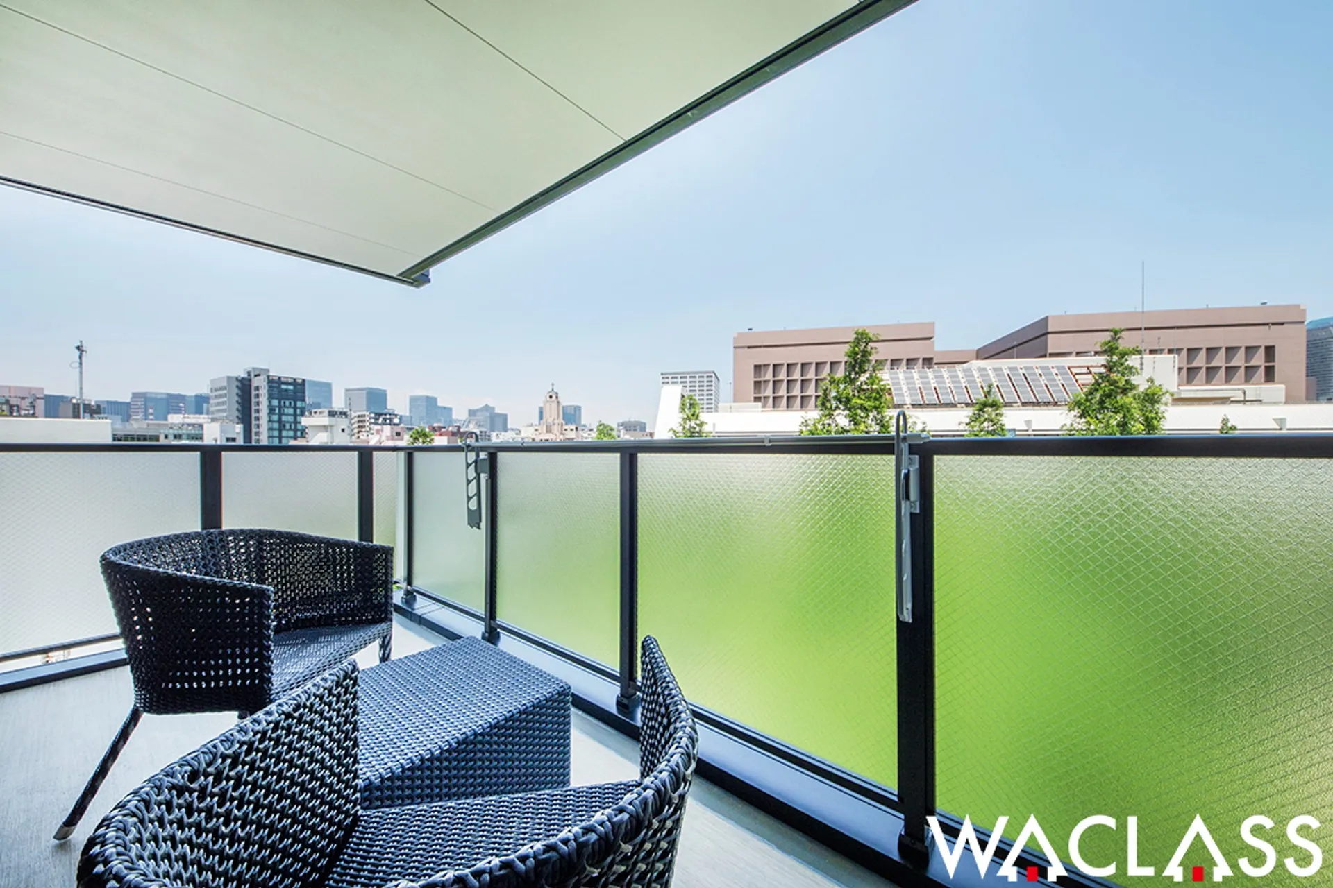 Balcony  of a WACLASS room overlooking the city