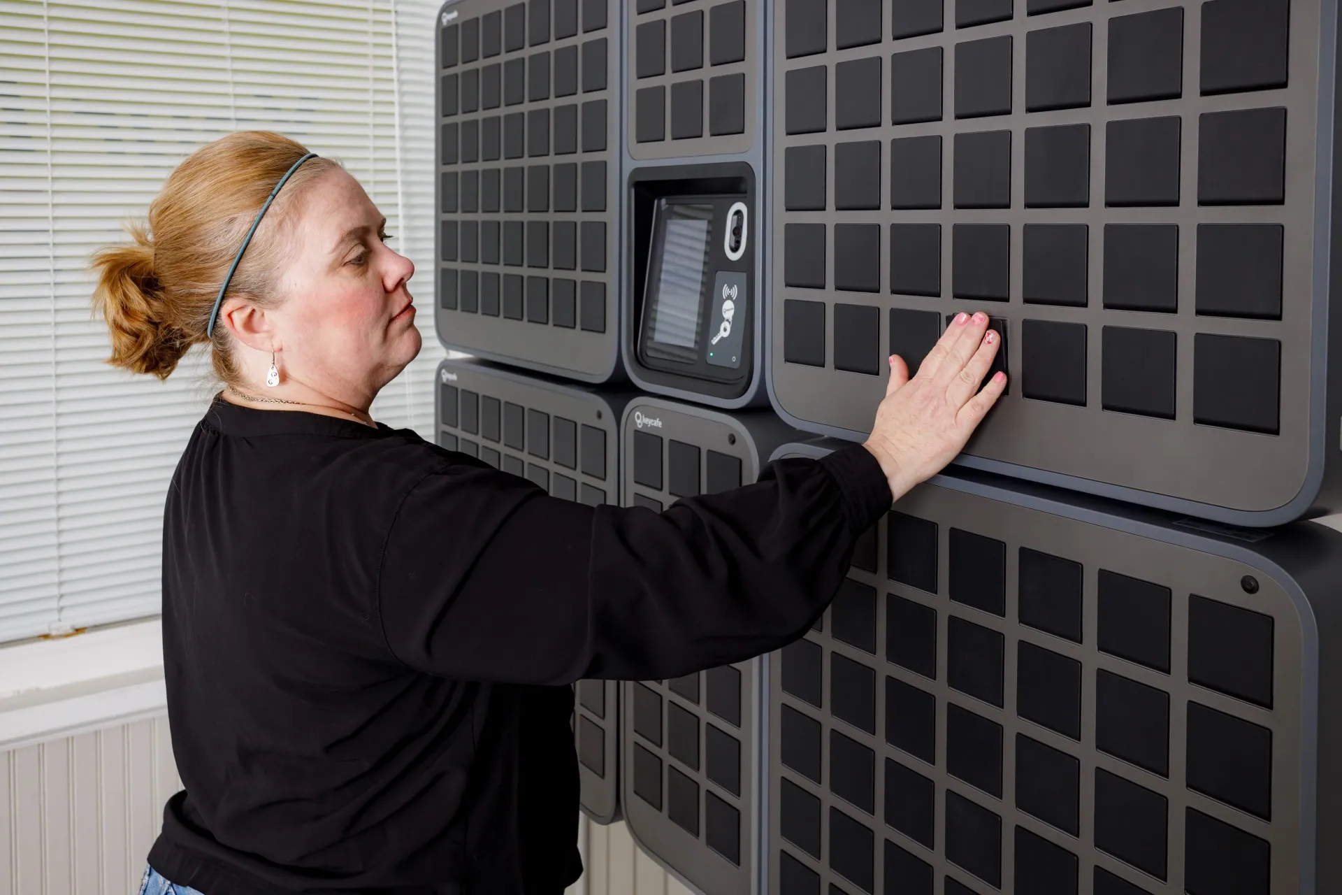 Your Place Property Management employee closing a SmartBox bin door
