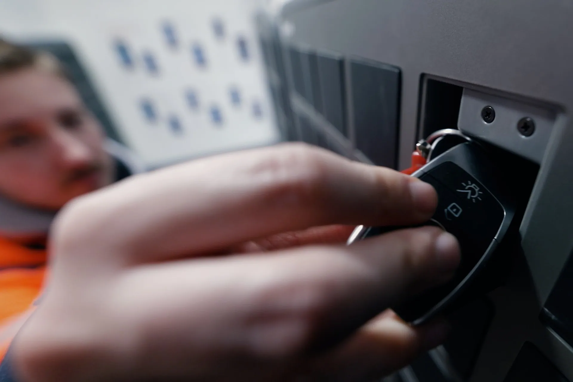 Close up of a hand placing a key in a SmartBox bin