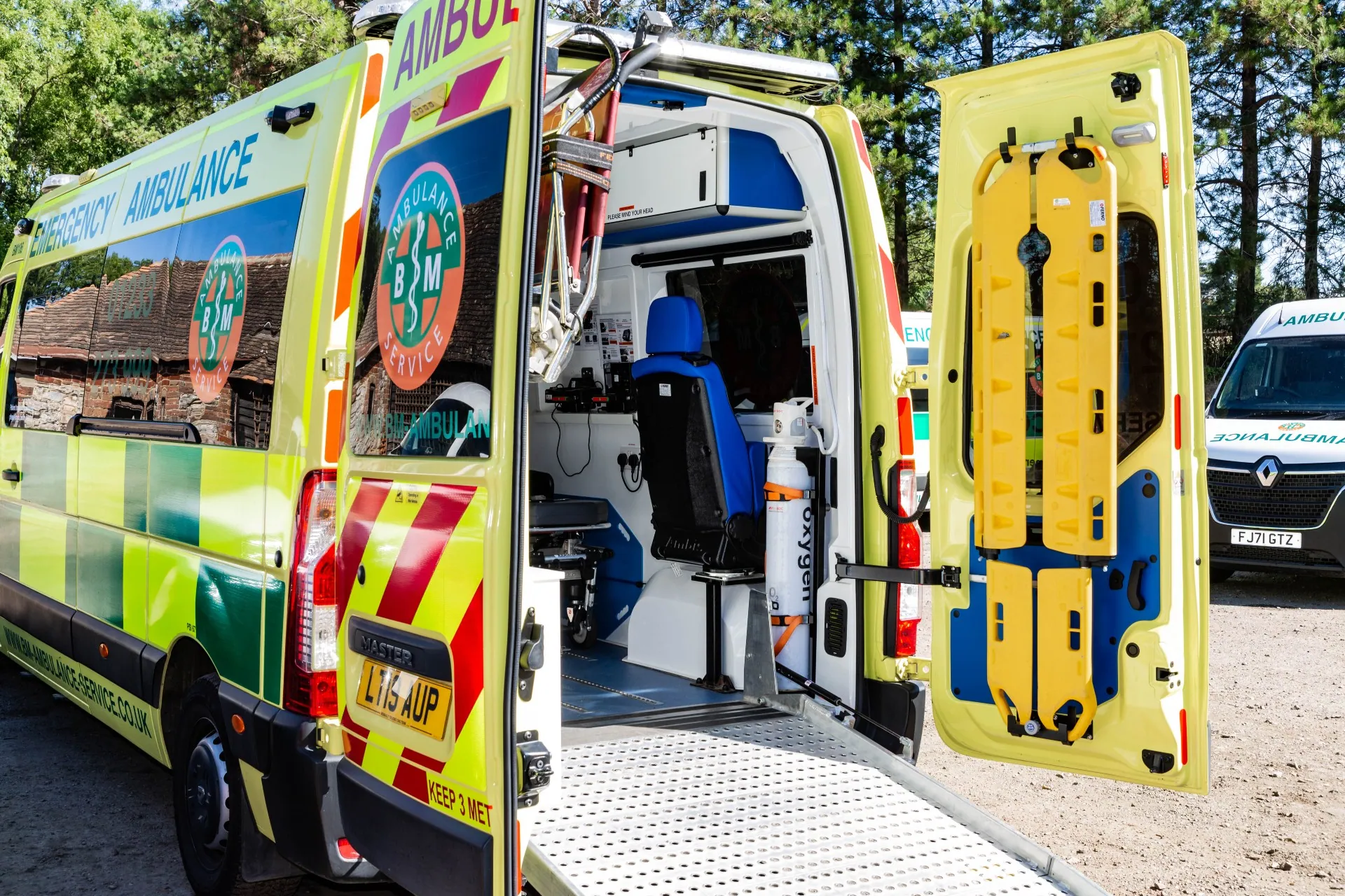 BM-branded ambulance with the rear doors open