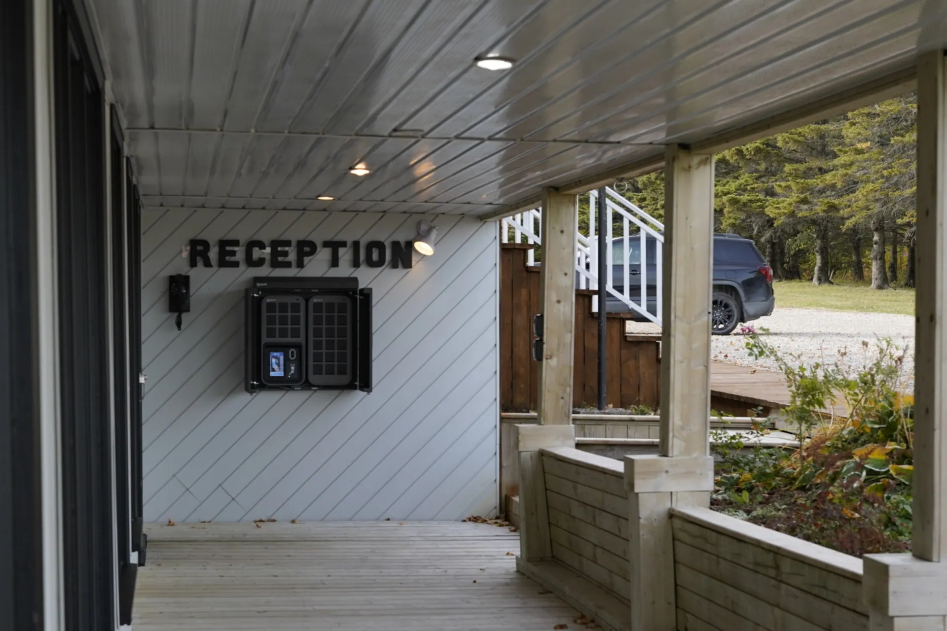 Outdoor SmartBoxes inside an enclosure under a "Reception" sign