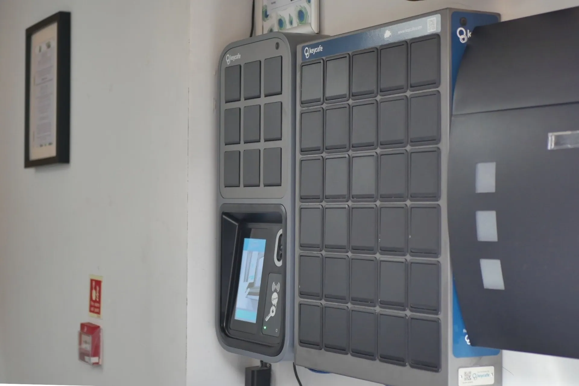 Keycafe smart key locker system with touchscreen for automated key management and hotel self check-in.
