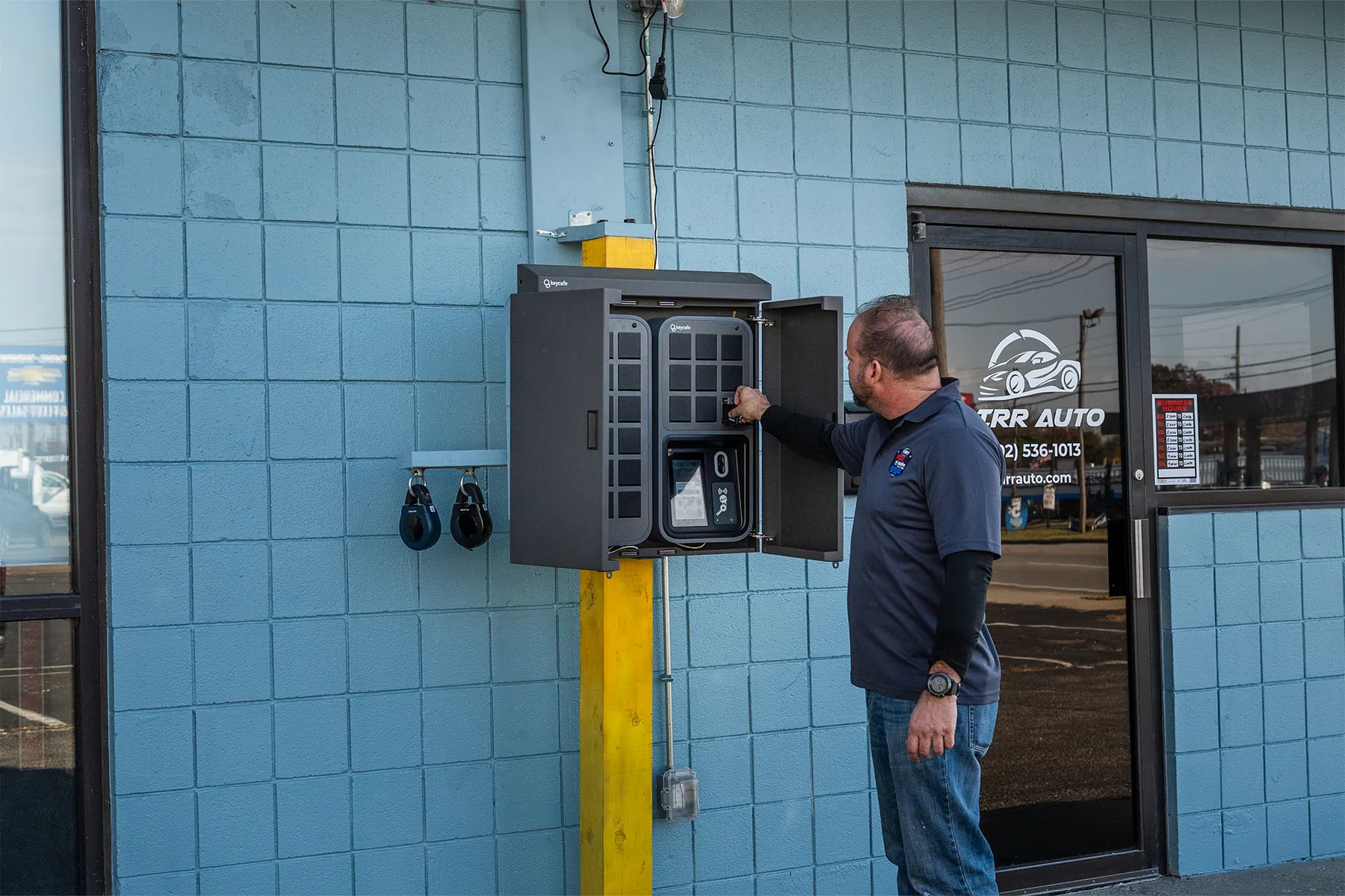 Joel Price placing a key inside the Keycafe SmartBox