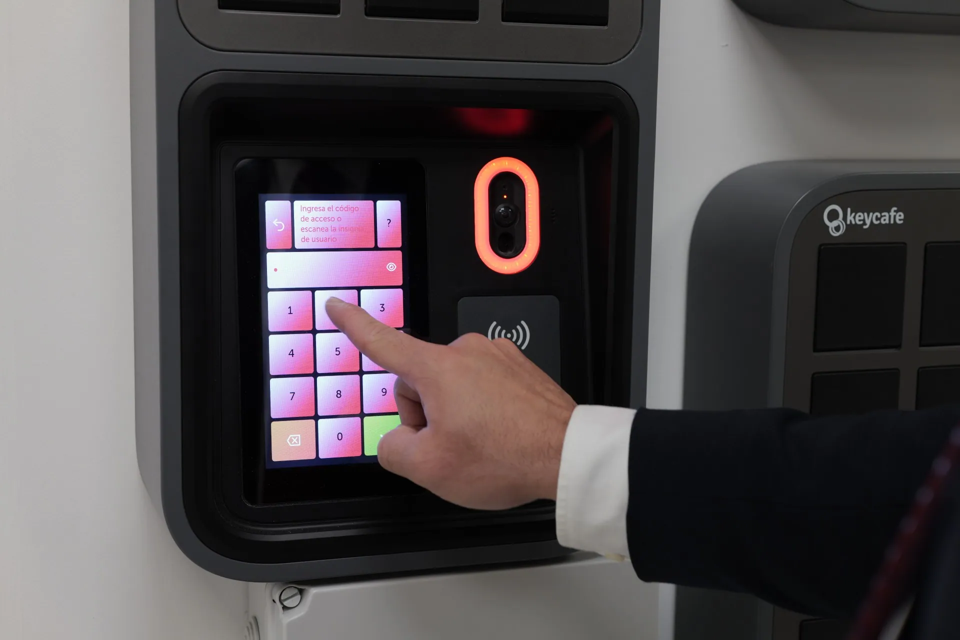 Close up of a hand entering a PIN at the SmartBox screen