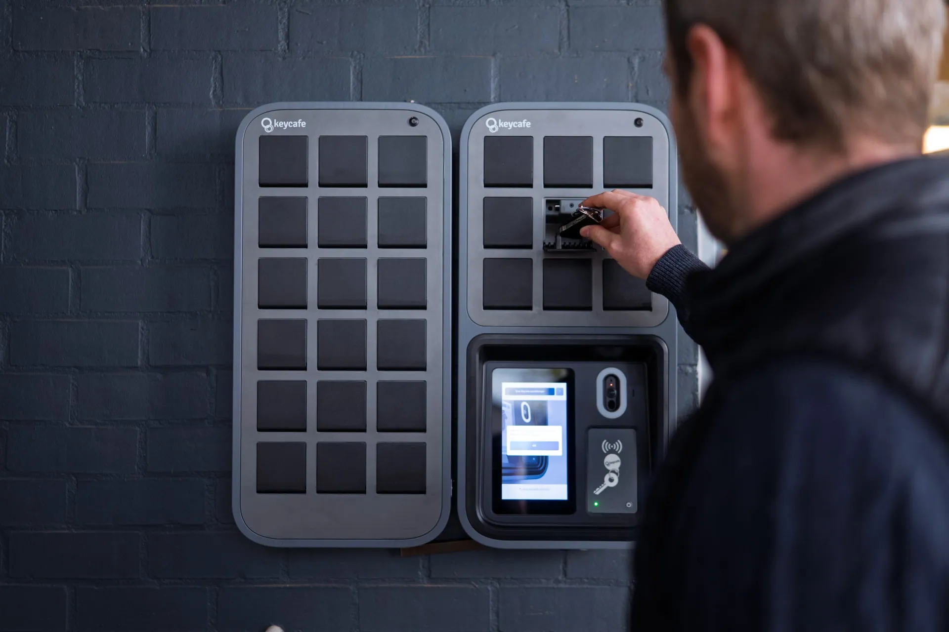 Manager Nico Vangeel taking keys out of a SmartBox bin