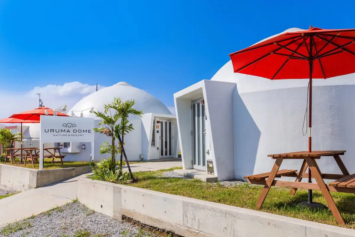 The Uruma Dome entrance sign near dome-shaped accomodations