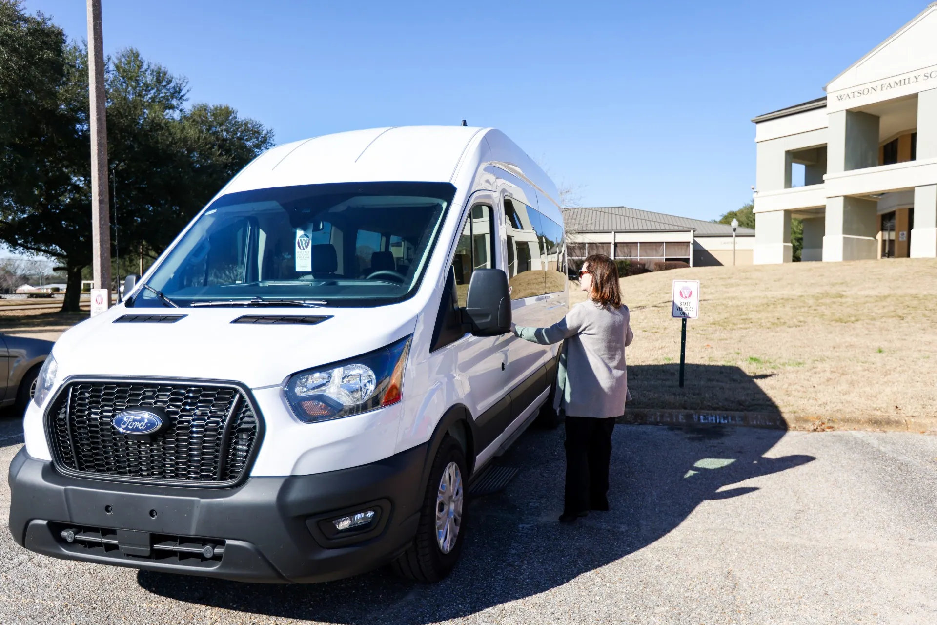 Student and Campus Services Specialist Laurel Rasberry getting into a Wallace Community College vehicle