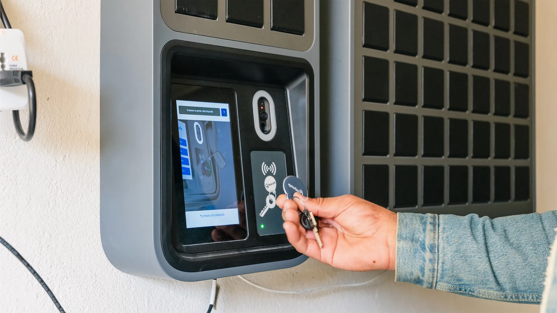 a man using the keycafe fob to drop off a key in the keycafe smartbox MS5