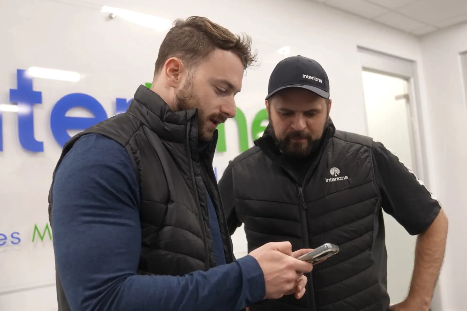 CEO Ethan Gershman and CRO Daniel Medanik looking at the Keycafe mobile app