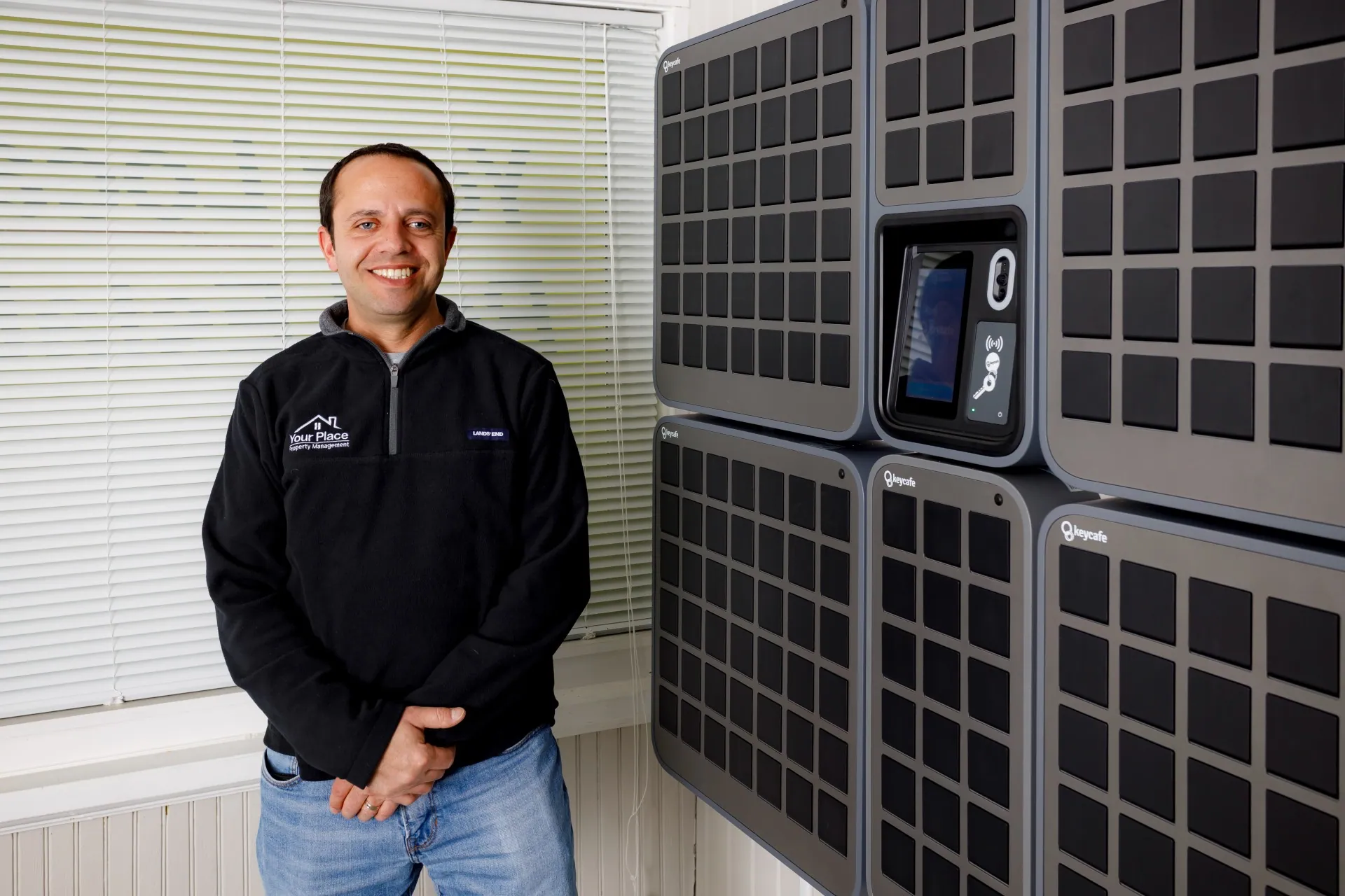 Your Place Property Management President Craig Caffarello standing beside his SmartBoxes