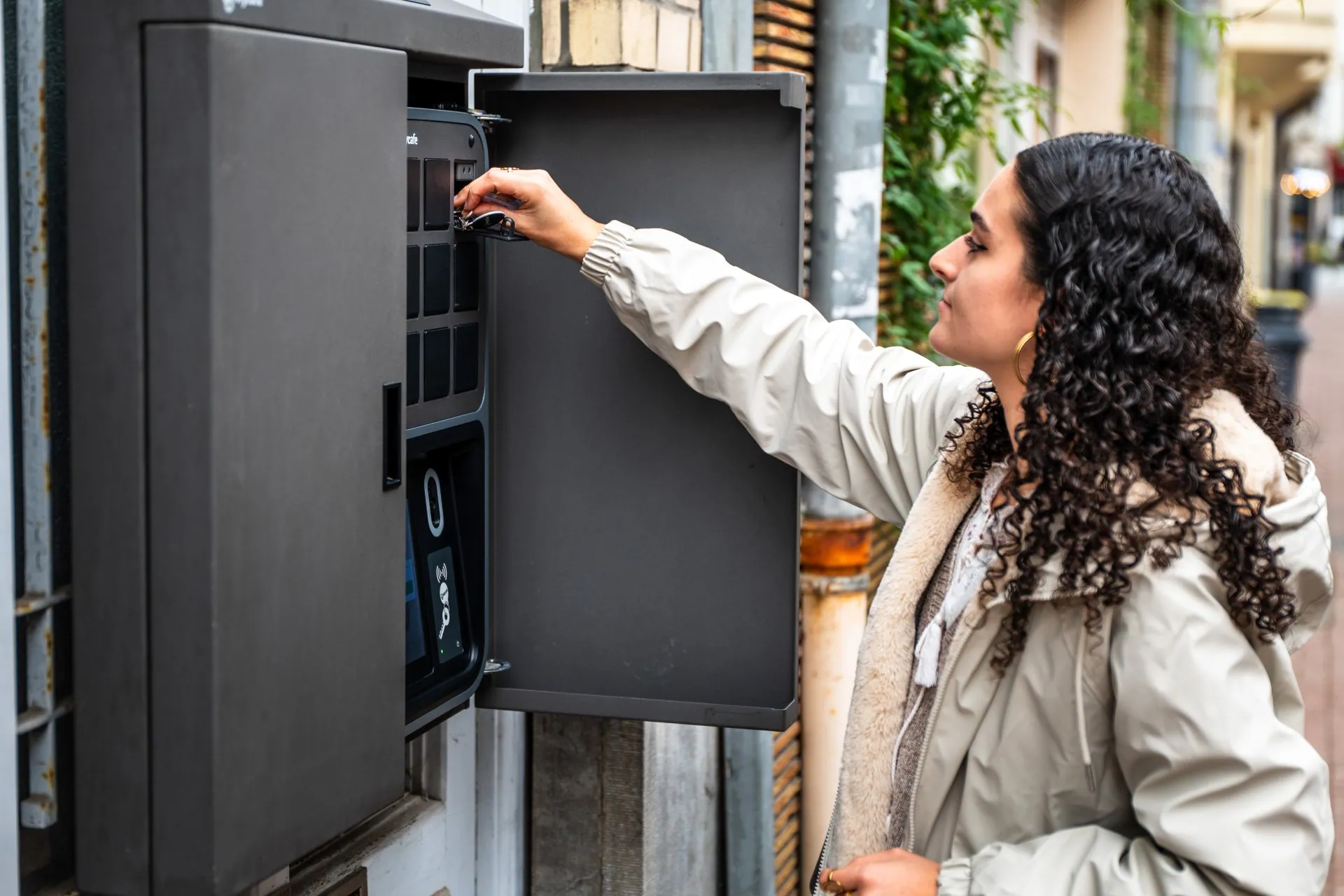 A guest returning a key to the SmartBox bin