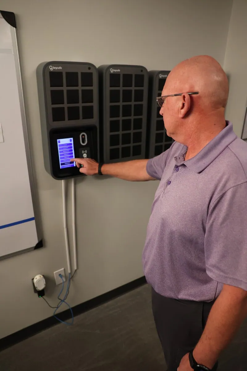 Concord Hospitality Chief Engineer Kevin Krause tapping a SmartBox screen