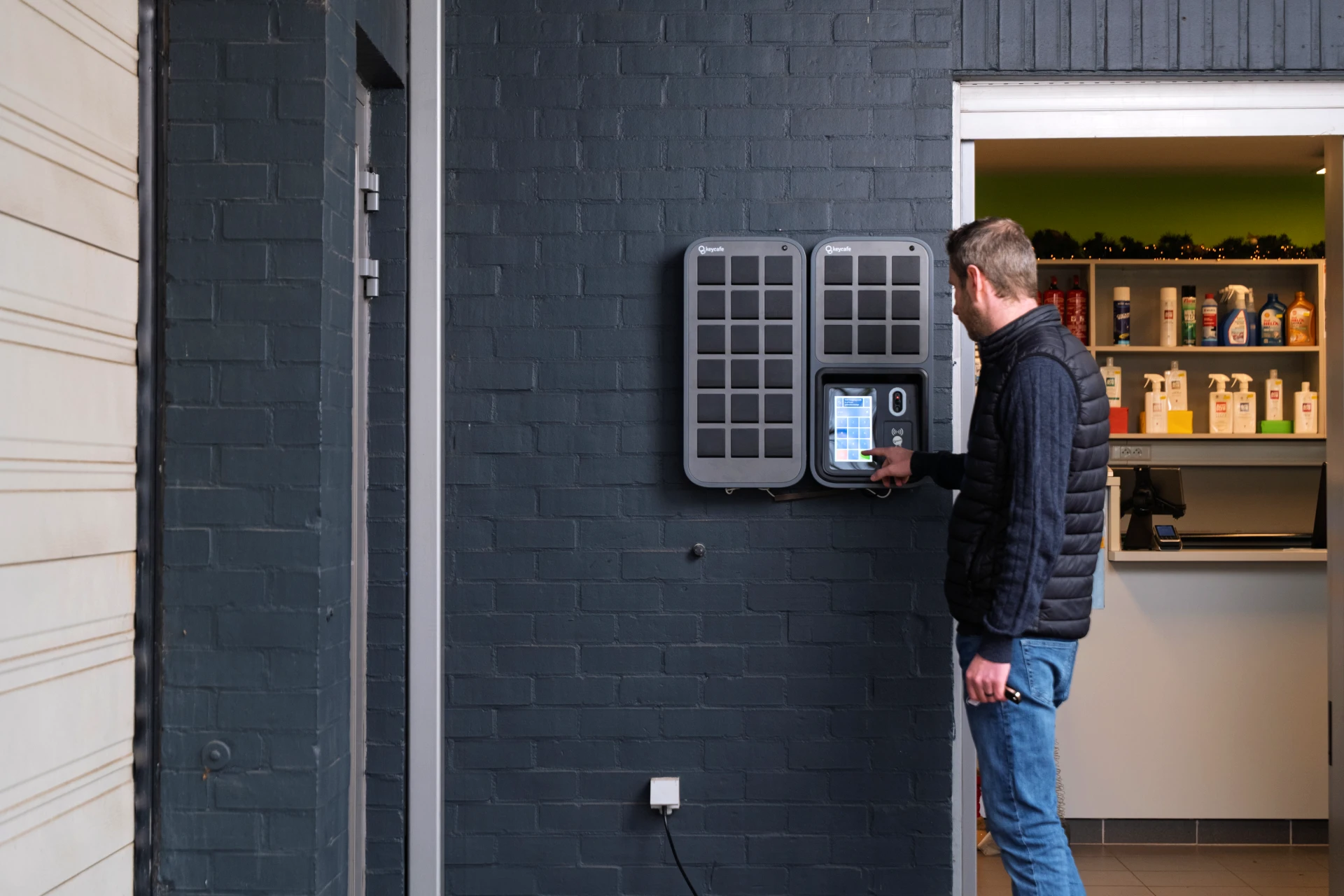 Manager Nico Vangeel tapping a SmartBox screen