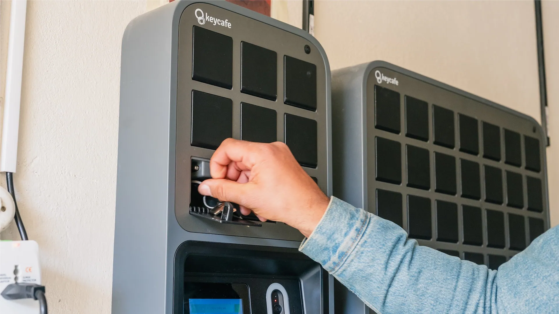 a man using the keycafe fob to drop off a key in the keycafe smartbox MS5