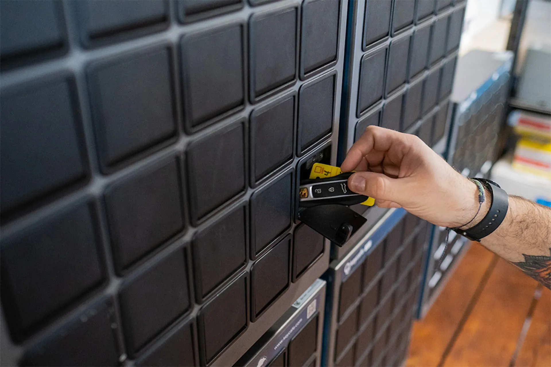 Digital Asset Manager Tyler Burley taking keys from a SmartBox bin