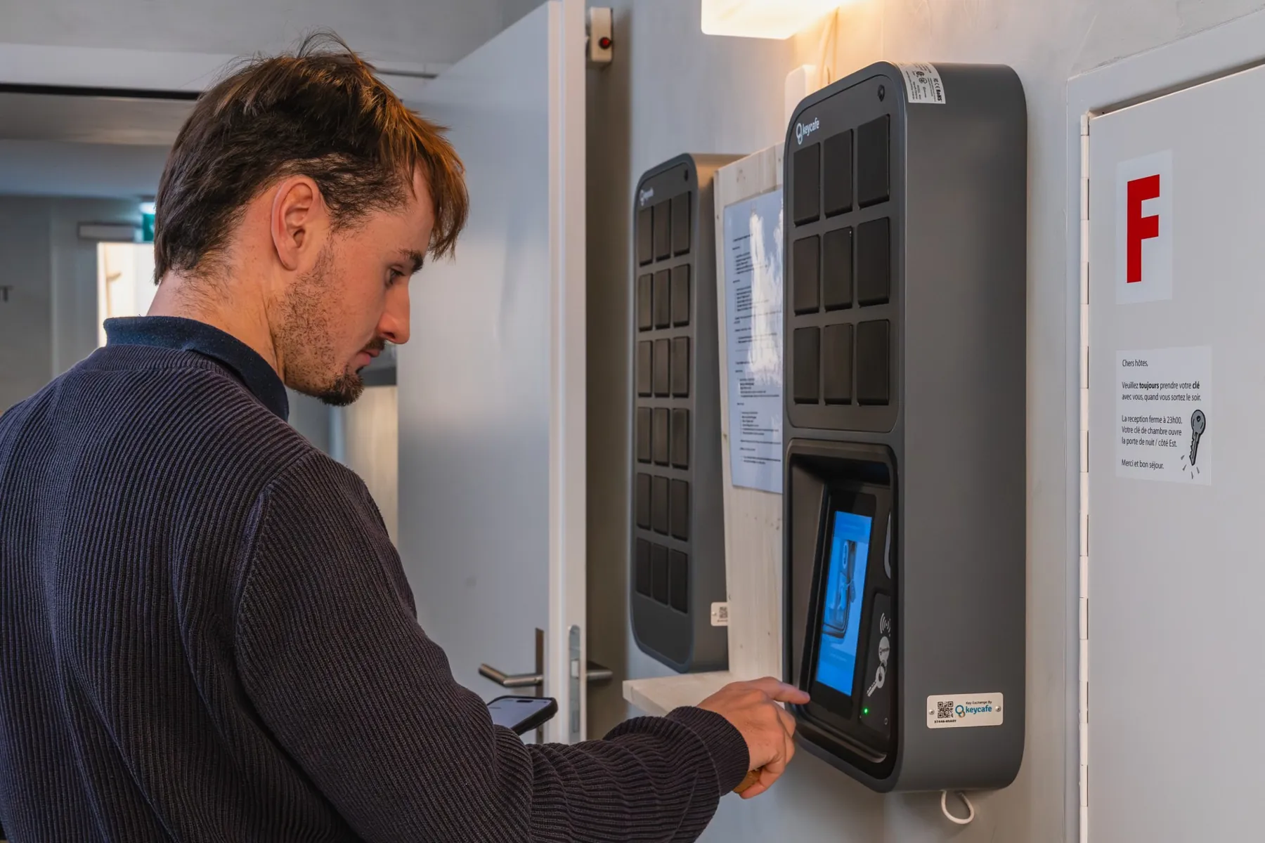 Man using a wall-mounted SmartBox