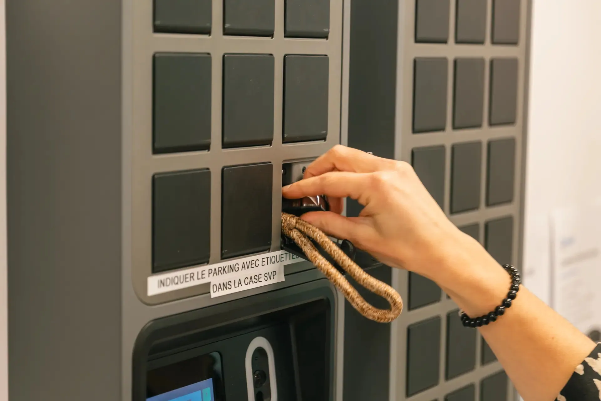 Close up of placing a key in a SmartBox bin