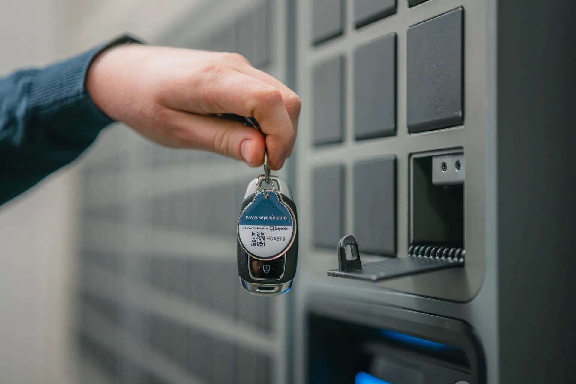 Close up taking a vehicle key out of a SmartBox bin