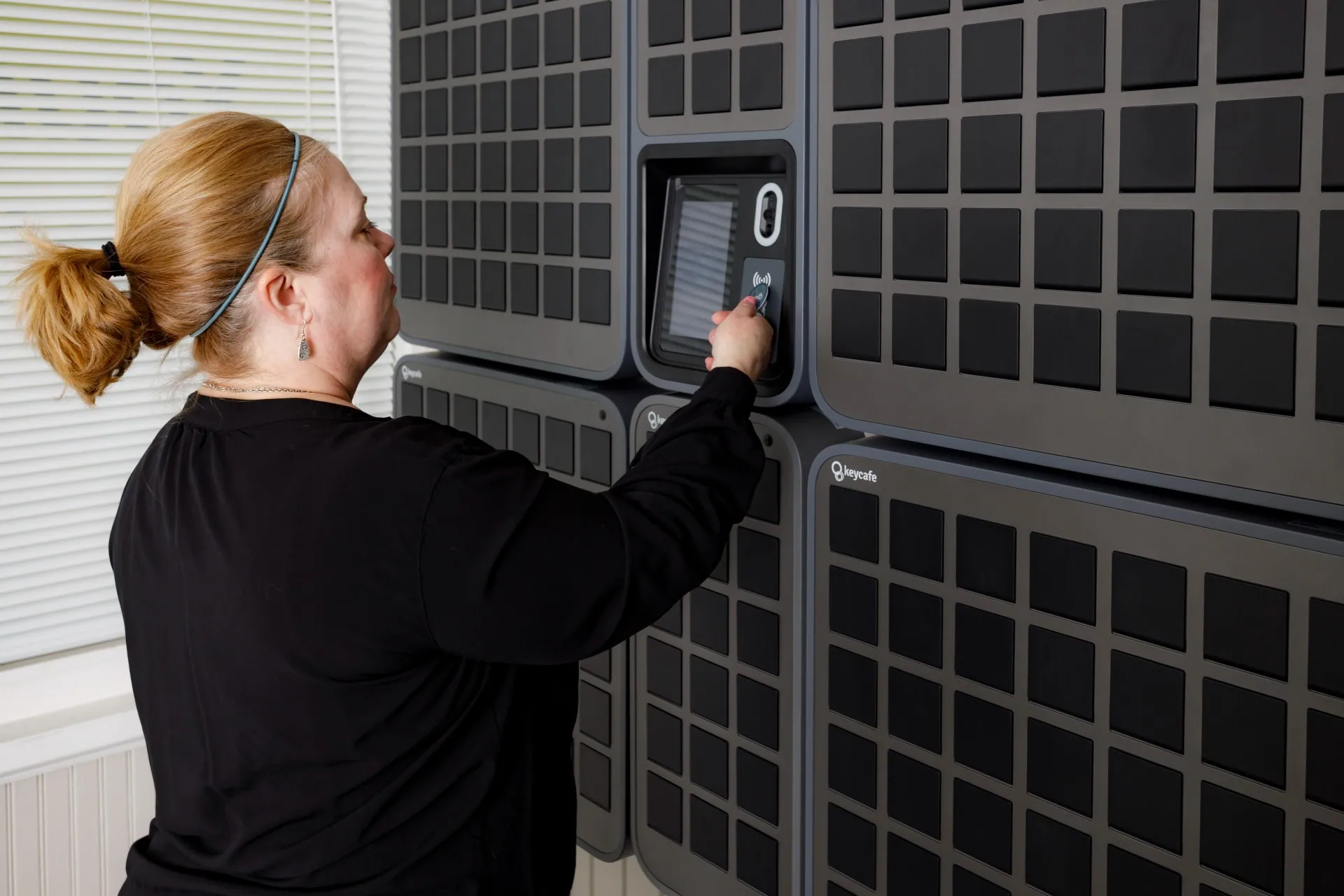 Your Place Property Management employee scanning a Keycafe fob at the SmartBox