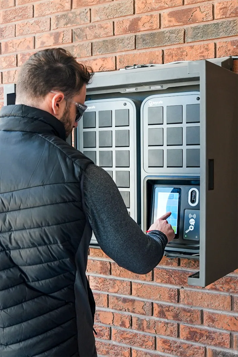 Interlane Car Transport staff member entering his PIN code at their outdoor SmartBox