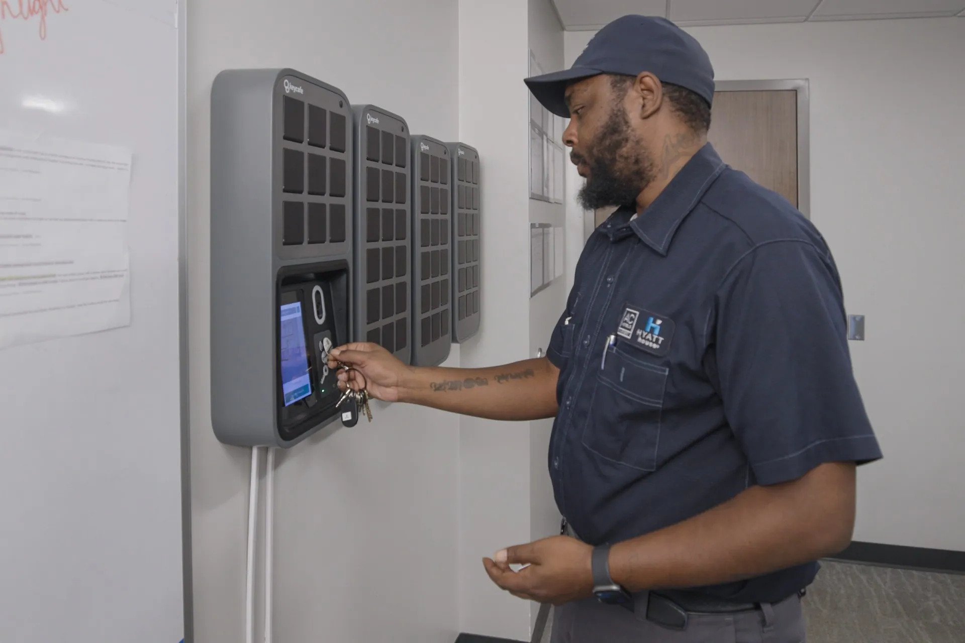 Concord Hospitality staff member scanning a Keycafe fob at the SmartBox