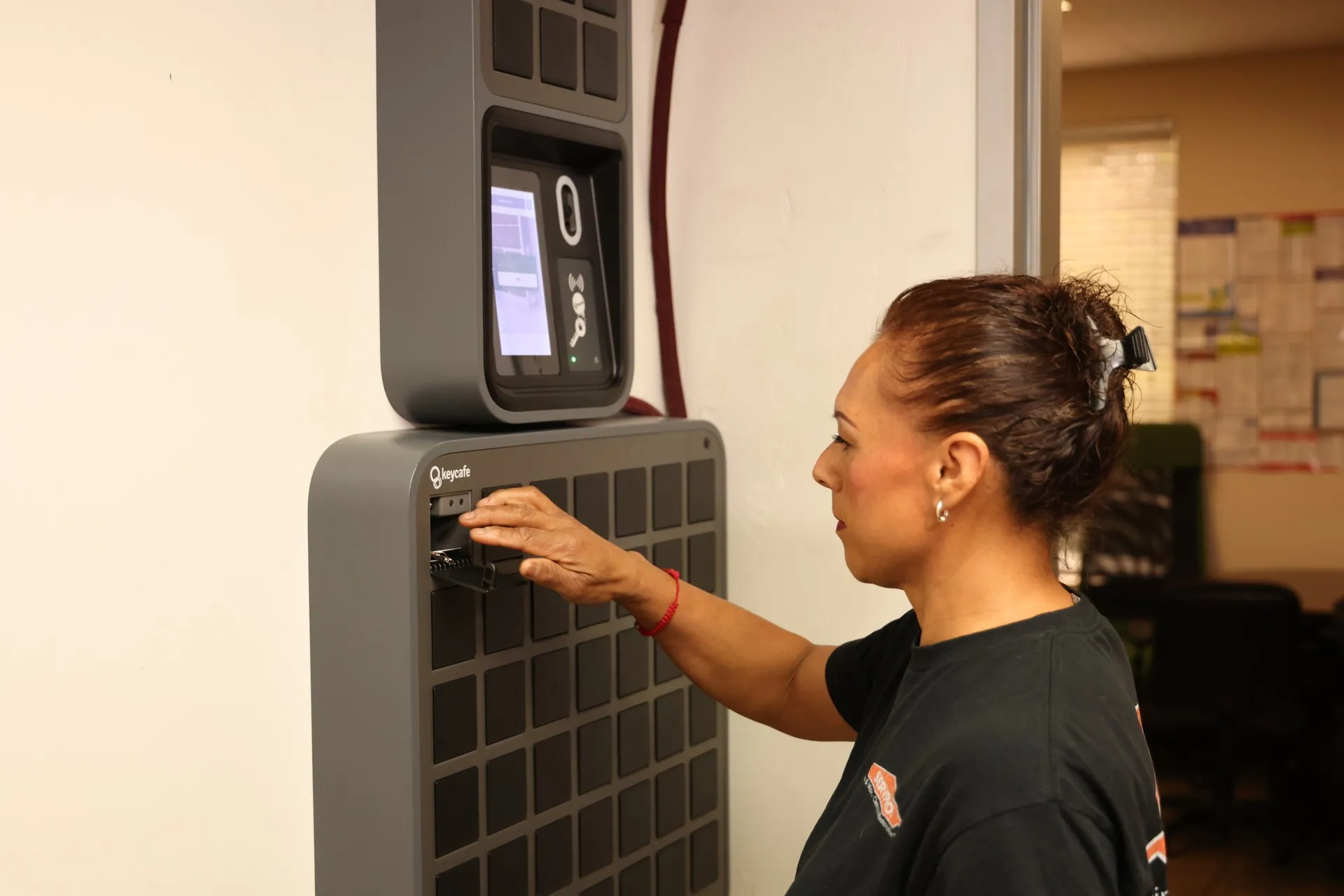 SERVPRO staff member taking keys from a SmartBox bin