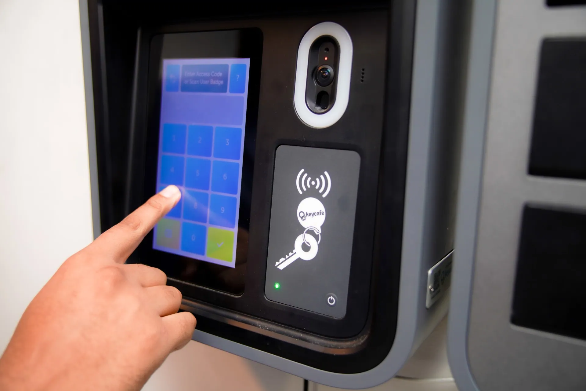 Close up of a staff member entering their PIN code on the SmartBox screen