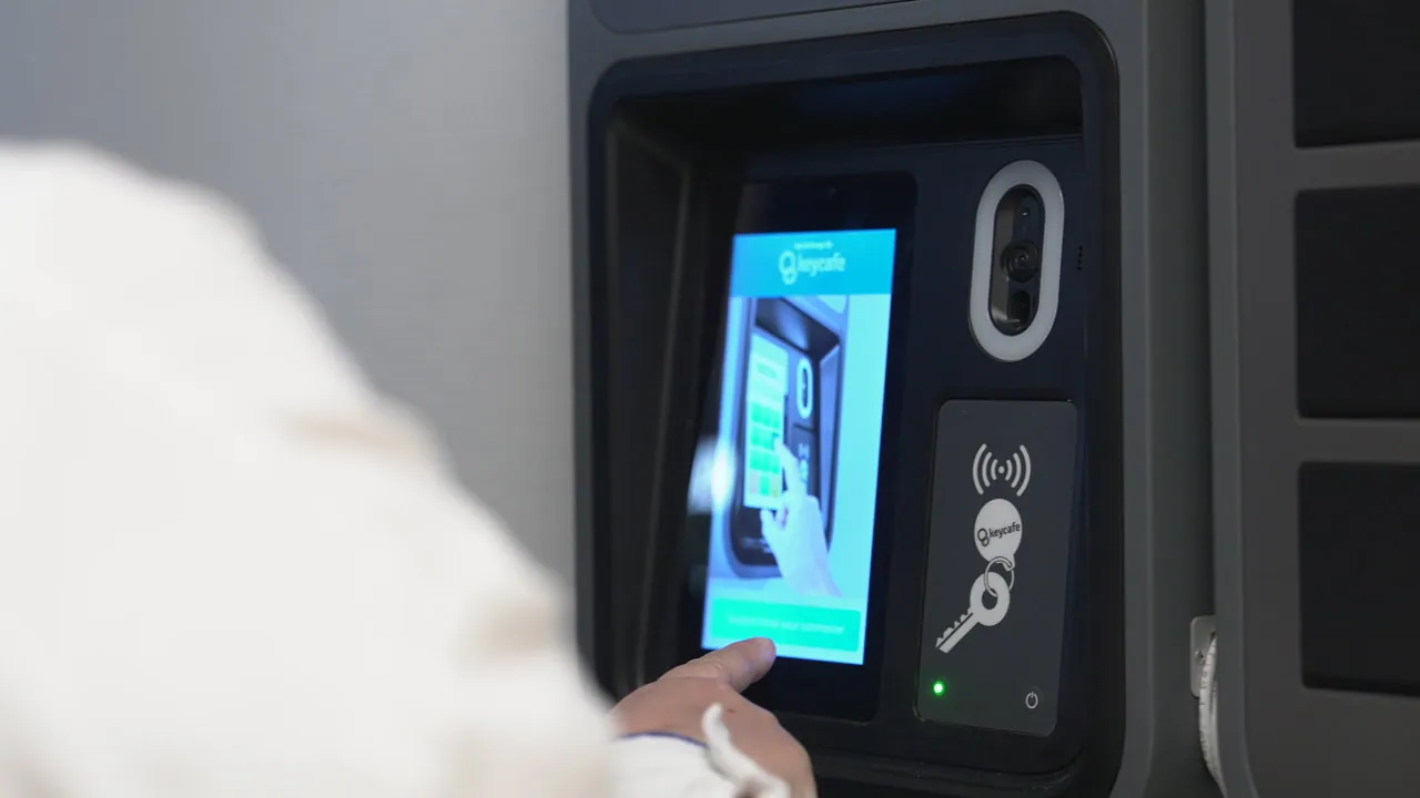 a person using the keycafe smartbox screen
