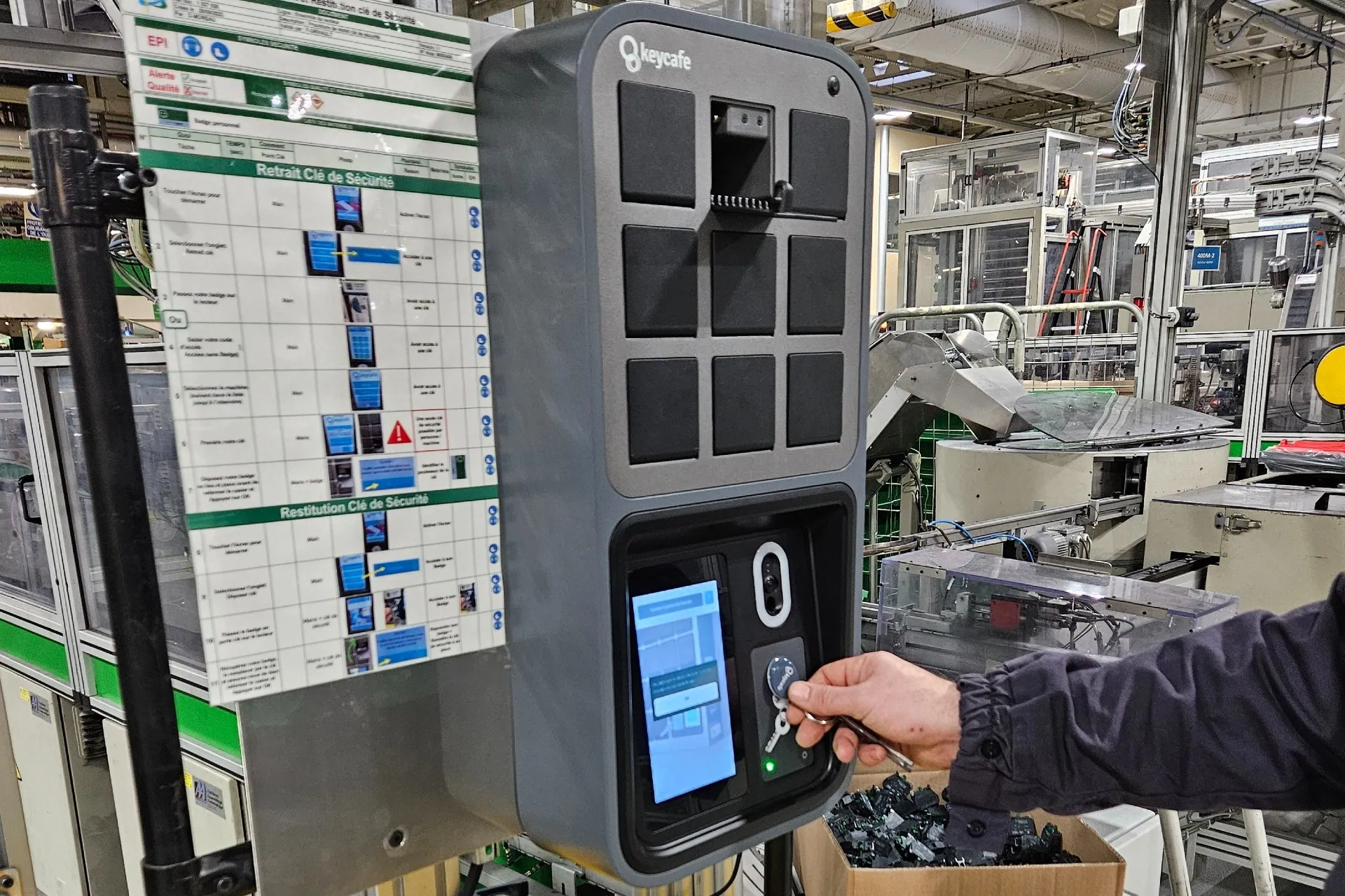 Staff member scanning a Keycafe fob at the SmartBox inside a warehouse
