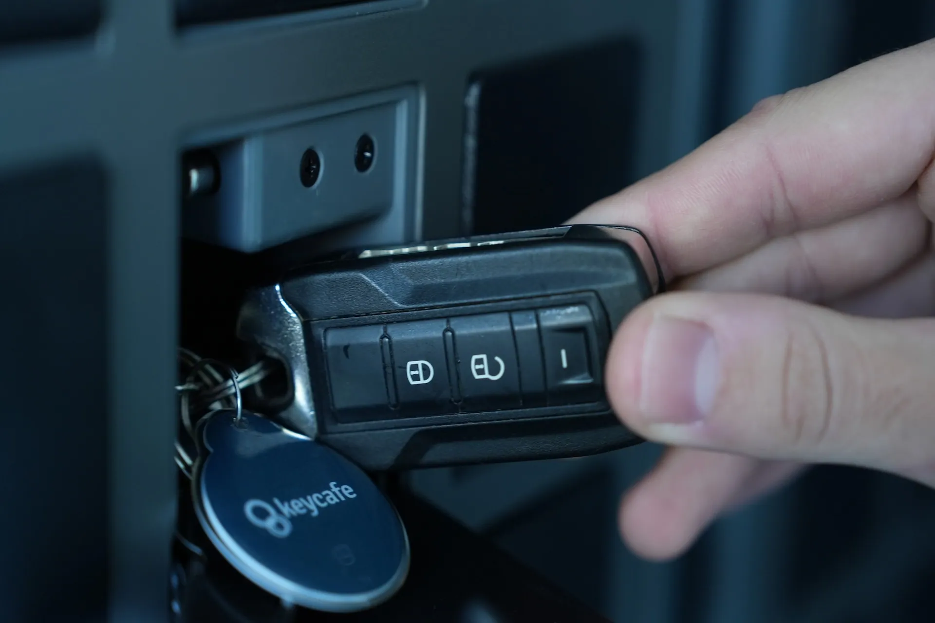 Close up of a key being placed in a SmartBox bin